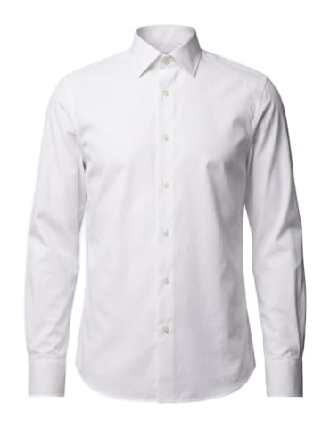 A white cotton poplin shirt with a point collar.